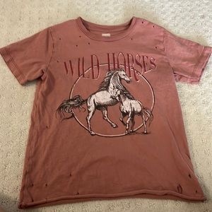 This is a kids western t shirt size medium. I haven’t worn it that much.